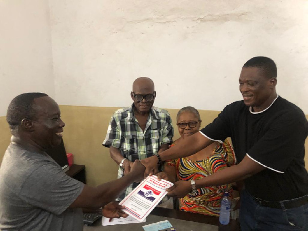 Erasmus Baidoo receiving the forms on behalf of the MP