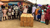 MP for Kwadaso, Dr. Kingsley Nyarko presenting items to some beneficiaries