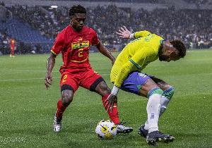 Black Stars defender, Tariq Lamptey (in red)