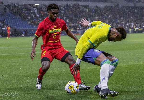 Black Stars defender, Tariq Lamptey (in red)