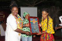 Madam Paulina Tangoba Abayage presenting a citation to Ms Rachel Lawerh