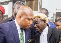 Samuel Okudzeto Ablakwa with his lawyer after the proceedings of the day