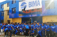 Some BIMA staff in a group picture after clean-up exercise