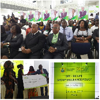 Officials of GES/SIC presenting GHC 126,000.00 to beneficiaries of the SICLife policy