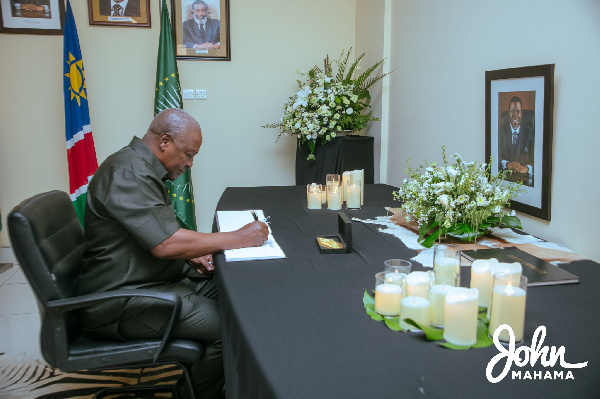 John Dramani Mahama signing the book of condolence