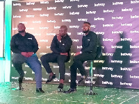 Stephen Appiah flanked by two reps from Betway company at the launch