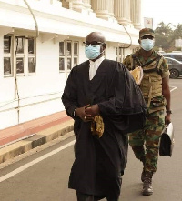 A soldier carrying the bag of President Akufo Addo