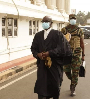 A soldier carrying the bag of President Akufo Addo