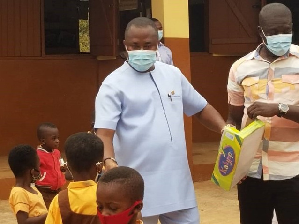 Mr Amoakohene, with the school children and other officials