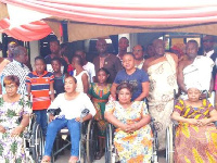 Members of the assembly with the beneficiary after the presentation