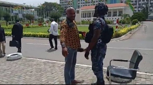 A man being checked before having access to Parliament