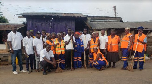 The Atiwa East NABCO trainees in a group photo after the clean up exercise