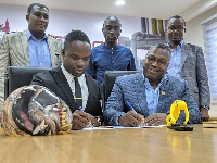 Akwasi Frimpong and  Ghana Gas CEO Dr. Ben Asante signing the contract