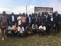 Prison officials, lawyers and some prisoners in a group photo