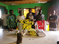 Head of Researching Jacob Martin (third) from right with a sample of the jersey