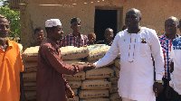 Assembly member for the area, Mr. Alfred Baiden recieving the items on behalf of the school