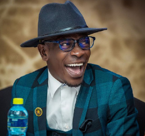 Shatta Wale beaming with smiles