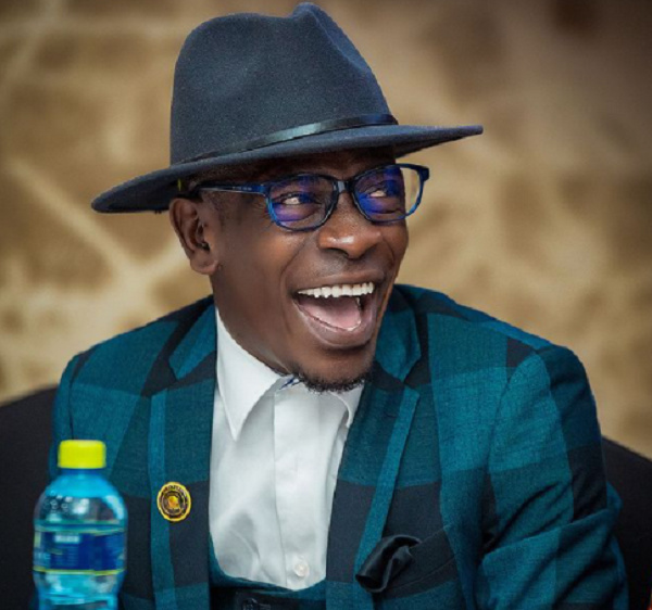 Shatta Wale beaming with smiles