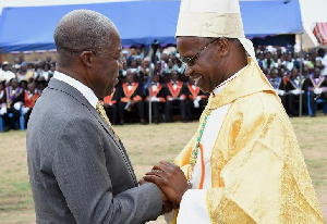 Veep Amissah-Arthur congratulating Most Rev. Richard Kuuia Baawobr