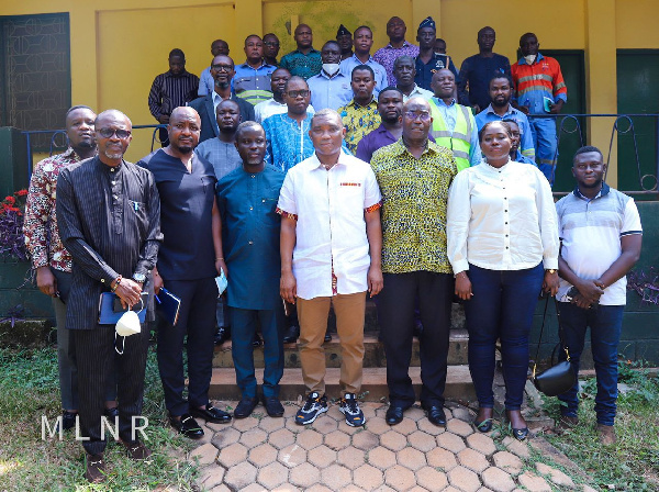 George Mireku Duker with some of the workers