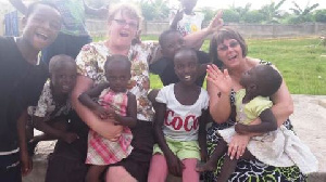 Jane Davison and Connie Peterson with some kids in the orphanage