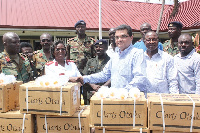 Rajesh Wadhwani (3rd right), presenting the items to Col Josephine Vowotoh