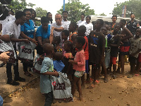 Children in a queue to taking their share of the food