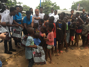 Children in a queue to taking their share of the food