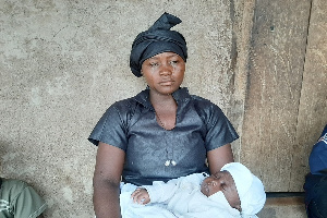 The widow, Laadi Ajuk Anabiri with her baby