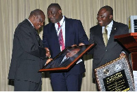 Retired Supreme Court Judge, William Atuguba, receiving his citation from GBA