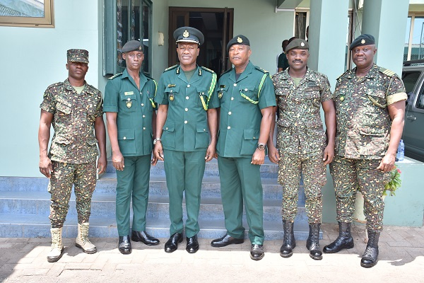 The five honured officers with the Comptroller-General of Immigration, Kwame Asuah Takyi