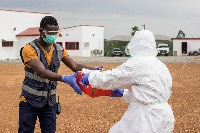 A Zipline personnel handing over an item