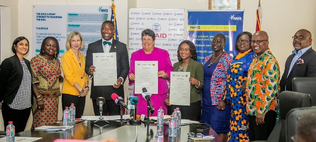 NHIA boss Bernard Okoe Boye (fourth left) and US ambassador (fifth left) at the signing event