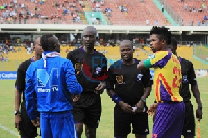 Godwin Attram of Olympics and Roben Gnagne in one of their clashes