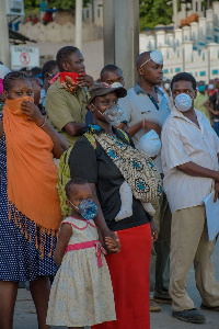 The woman was pictured with her daughter wearing a nose mask made out of a plastic bottle