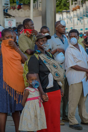 The woman was pictured with her daughter wearing a nose mask made out of a plastic bottle