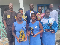 Students display the awards they won at the Ghana Education Awards