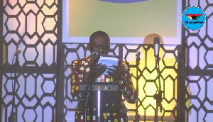 Akrobeto reading the Bible at MTN 9 Lessons and Carols