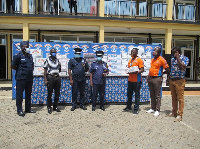 A group photo of staff of Promasidor Ghana and officers of the Greater Accra regional police command