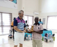 Charles  Baiden receiving his trophy