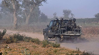 Members of the Cameroonian Rapid Intervention Force patrol Mosogo