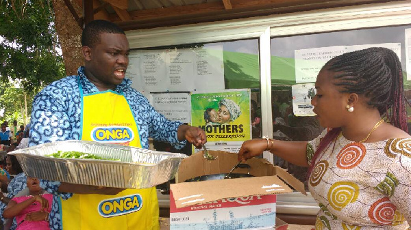 Rev. Fr. Courage Senam Dogbey busily preparing Indomie