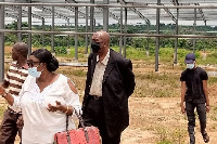 Dr. Joseph Yaw Mensah (in black mask) is a United States-based Ghanaian investor