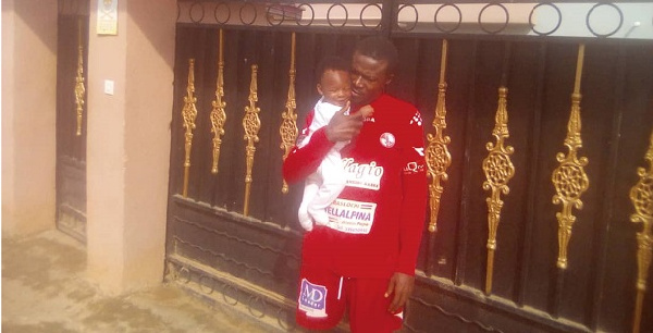 Owusu Banahene and his newborn son