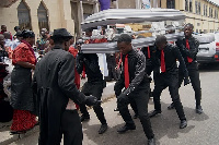 Dancing pallbearers performing at a funeral