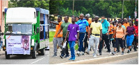 Staff of Access Bank walk the streets of Accra