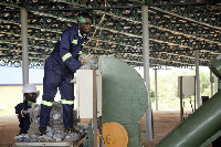 An operator works with the solid waste plant