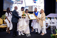 Bishop Agyinasare (third left) receives his plaque