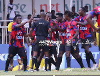 Legon Cities players and referee Charles Buluu