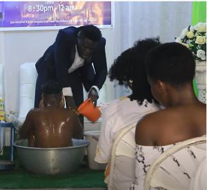 Pastor Bathing A Church Member.png